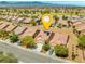 Community neighborhood showcasing residences with tile roofs, solar panels and well-maintained landscaping at 7669 Fieldfare Dr, North Las Vegas, NV 89084