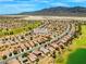 Community aerial view showing houses, street names, a golf course, and desert landscape at 7669 Fieldfare Dr, North Las Vegas, NV 89084