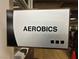 Close-up of an 'Aerobics' sign, indicating community fitness facilities with accessibility via Braille at 7669 Fieldfare Dr, North Las Vegas, NV 89084