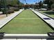 Outdoor bocce ball court with well-maintained artificial turf and concrete borders at 7669 Fieldfare Dr, North Las Vegas, NV 89084