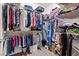Walk-in closet with ample storage for clothes, shoes, and accessories at 7669 Fieldfare Dr, North Las Vegas, NV 89084