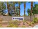 Sun City Aliante community sign surrounded by mature palm trees and well-maintained landscaping at 7669 Fieldfare Dr, North Las Vegas, NV 89084