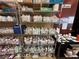 Shelves stocked with various paints and supplies for creative pottery projects at 7669 Fieldfare Dr, North Las Vegas, NV 89084
