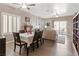 Comfortable dining room with wood floors and a large window filling the space with natural light at 7669 Fieldfare Dr, North Las Vegas, NV 89084