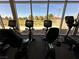 Bright fitness center featuring stationary bikes and panoramic views of the outdoor landscape at 7669 Fieldfare Dr, North Las Vegas, NV 89084