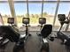 Well-equipped fitness center featuring stationary bikes, large windows, and scenic outdoor views at 7669 Fieldfare Dr, North Las Vegas, NV 89084