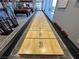 Clubhouse game room featuring a wooden shuffleboard table with numbered sections at 7669 Fieldfare Dr, North Las Vegas, NV 89084