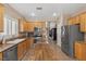 Bright kitchen featuring stainless steel appliances, a wood island, and ample storage at 7669 Fieldfare Dr, North Las Vegas, NV 89084