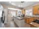 Updated kitchen with stainless steel appliances, custom cabinets, and a center island at 7669 Fieldfare Dr, North Las Vegas, NV 89084