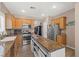 Well-equipped kitchen with stainless steel appliances and a rustic island at 7669 Fieldfare Dr, North Las Vegas, NV 89084