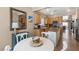 Open-concept kitchen with stainless steel appliances, an island, and a breakfast nook at 7669 Fieldfare Dr, North Las Vegas, NV 89084