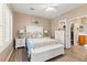 Serene main bedroom with wood-look floors, neutral walls, and ample natural light, offering comfort at 7669 Fieldfare Dr, North Las Vegas, NV 89084