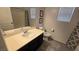 Bathroom with a single sink vanity and neutral finishes at 7704 Classy Cashmere Ct, Las Vegas, NV 89149