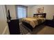 Cozy bedroom with neutral decor, plush bedding, and dark wooden furniture at 7704 Classy Cashmere Ct, Las Vegas, NV 89149