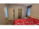 Bright bedroom with a closet and a large bed featuring a vibrant floral pattern at 7704 Classy Cashmere Ct, Las Vegas, NV 89149