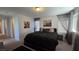 Bedroom with carpet, queen bed, and two city landscape pictures at 7704 Classy Cashmere Ct, Las Vegas, NV 89149