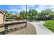 Entrance to The North Commons, featuring manicured lawns and paved walkways at 7704 Classy Cashmere Ct, Las Vegas, NV 89149