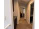 Hallway with storage that connects the bedrooms and bathrooms at 7704 Classy Cashmere Ct, Las Vegas, NV 89149