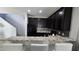 Beautiful kitchen with dark cabinets, granite countertops, and stainless steel appliances at 7704 Classy Cashmere Ct, Las Vegas, NV 89149