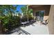 Cozy patio with comfortable chairs and a side table perfect for relaxing outside at 7704 Classy Cashmere Ct, Las Vegas, NV 89149