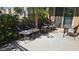 Cozy patio with comfortable chairs and a side table perfect for relaxing outside at 7704 Classy Cashmere Ct, Las Vegas, NV 89149