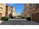Neighborhood street with houses and attached garages at 7704 Classy Cashmere Ct, Las Vegas, NV 89149