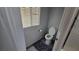 Toilet room with toilet, window, and gray bath mat at 7704 Classy Cashmere Ct, Las Vegas, NV 89149