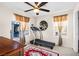 Bedroom with a treadmill, full-length mirror and decor at 7724 Somerhill Point Way, Las Vegas, NV 89139