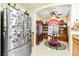 Cozy kitchen with a breakfast nook featuring tile floors and stainless steel appliances at 7724 Somerhill Point Way, Las Vegas, NV 89139