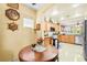 Bright kitchen featuring wood cabinets, a breakfast nook, and modern stainless appliances at 7724 Somerhill Point Way, Las Vegas, NV 89139