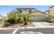 Charming two-story home with well-manicured front yard and a two-car garage at 7724 Somerhill Point Way, Las Vegas, NV 89139