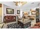 Spacious living room showcasing elegant furnishings, tile flooring, and an open layout at 7724 Somerhill Point Way, Las Vegas, NV 89139