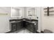 Luxurious bathroom with double sinks, stone countertops, modern lighting, and elegant decor at 9029 Rivers Edge Dr, Las Vegas, NV 89117