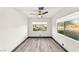 Bright, empty bedroom with gray wood-look floors and natural light at 9029 Rivers Edge Dr, Las Vegas, NV 89117
