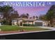 Charming single-story home with a well-manicured lawn, tile roof, and a two-car garage in a desirable neighborhood at 9029 Rivers Edge Dr, Las Vegas, NV 89117