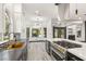 Well-designed kitchen featuring a marble island, stainless appliances, and modern finishes at 9029 Rivers Edge Dr, Las Vegas, NV 89117
