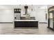 Modern kitchen with sleek cabinets, stainless steel appliances, and a large island for cooking at 9029 Rivers Edge Dr, Las Vegas, NV 89117