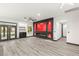 Modern living room boasting sleek floors, a fireplace, and a view of the backyard at 9029 Rivers Edge Dr, Las Vegas, NV 89117