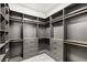 Organized walk-in closet with gray shelving, drawers, and gold rods at 9029 Rivers Edge Dr, Las Vegas, NV 89117