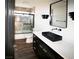 Bathroom with dark vanity, stylish fixtures, and shower-tub combination at 912 Pro Players Dr, Las Vegas, NV 89134