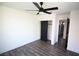 Bedroom with gray floors, a ceiling fan, and sliding closet doors at 912 Pro Players Dr, Las Vegas, NV 89134