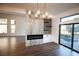 Dining room with fireplace, television, and a view of the backyard pool at 912 Pro Players Dr, Las Vegas, NV 89134