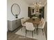 Stylishly staged dining room with a view into the gourmet kitchen at 912 Pro Players Dr, Las Vegas, NV 89134
