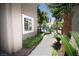 Side view of a home with lush greenery and palm trees enhancing its curb appeal at 912 Pro Players Dr, Las Vegas, NV 89134