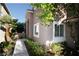Exterior view of a home with manicured bushes and a walkway, offering great curb appeal at 912 Pro Players Dr, Las Vegas, NV 89134