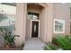 Inviting front entrance featuring a dark wood door, and a well-maintained facade at 912 Pro Players Dr, Las Vegas, NV 89134