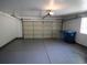 Spacious two car garage with epoxy flooring, providing ample parking and storage space at 912 Pro Players Dr, Las Vegas, NV 89134