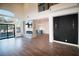 Bright living area with fireplace, television, and a view of the backyard pool at 912 Pro Players Dr, Las Vegas, NV 89134