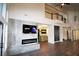 Spacious living room boasts high ceilings, a modern fireplace, and elegant hardwood flooring at 912 Pro Players Dr, Las Vegas, NV 89134