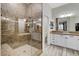 Bathroom with walk-in shower with glass enclosure and double vanity with under-mount sinks at 9349 Olympia Falls Ave, Las Vegas, NV 89149